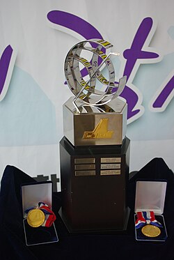 The Championship Trophy and gold medals given to the winning team