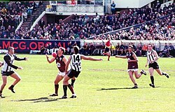 Alastair Lynch of Fitzroy FC attempts a one handed chest mark