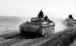 German Panzer III of the Afrika Korps advancing across the North African desert, April 1941