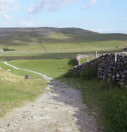 Limestone hills and dry-stone walls in the west of the Yorkshire Dales. This part of the national park is popular with walkers due to the presence of the Yorkshire Three Peaks.