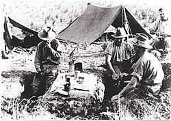 Imperial Camel Corps Brigade troopers having breakfast in a 'funk hole' near Jaffa.
