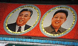 Portraits of Kim Jong Un's father and grandfather (Arirang Festival mass games in Pyongyang)
