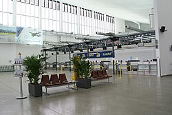 Check-in area inside the main hall, the interior has since been rearranged to accommodate longer queues and bag drop machines.