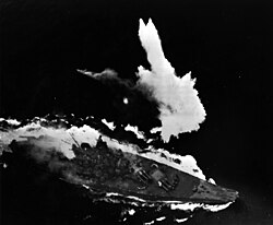 The Japanese battleship Yamato under heavy air attack and burning badly in April 1945