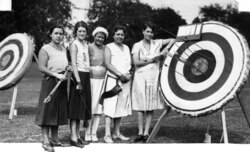 Five women taking part in an archery contest in 1931