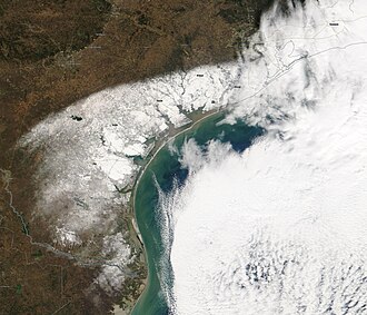 A satellite image of South Texas and northeastern Mexico on Christmas morning, showing the extent of the snowfall.(Click on the image and zoom in for place labels)