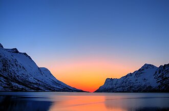 Rayleigh scattering causes the blue color of the sky at large angles to the direction of solar rays and yellow or orange colors for light from the direction of the Sun.[1]