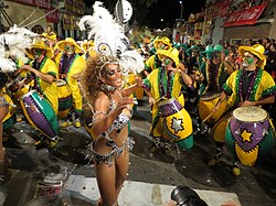 Carnival dancer and drummers.