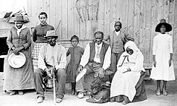 Harriet Tubman with family and ex-slaves; sitting at left is Tubman's second husband, Nelson Davis (8th USCT veteran)
