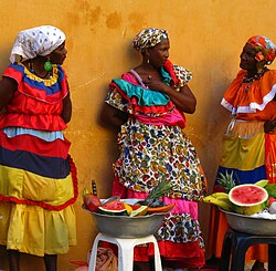 Palenquera women making traditional fruit baskets in the streets of Cartagena