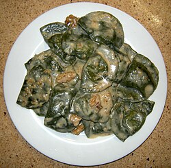 Ligurian pansoti filled with preboggion boiled greens and served with nut sauce