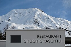 Swiss German restaurant sign in Andermatt: "Chuchichäschtli", in Standard German "Küchenkästlein"