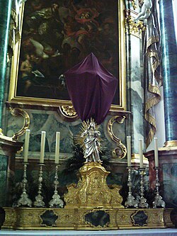A crucifix on the high altar is veiled for Lent. Saint Martin's parish, Württemberg, Germany