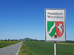 State border with North Rhine-Westphalia near Warburg; in the background the Desenberg, with 345 m landmark and highest point in the Warburger Börde near the border triangle NRW - Hesse - Lower Saxony