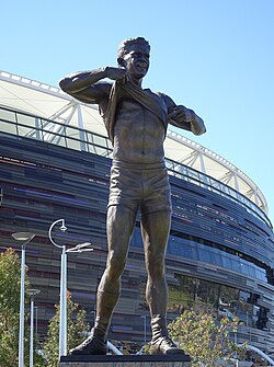 Statue of Indigenous Hall of Famer Nicky Winmar pointing to his skin in 1993 in protest of racial vilification, erected outside Perth Stadium in 2019
