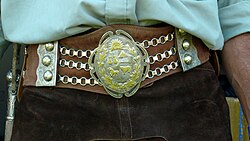 Some gauchos flaunted their alpaca sash decorations.