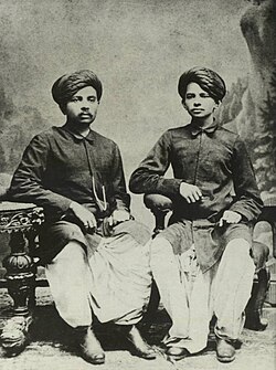 Gandhi (right) with his eldest brother Laxmidas in 1886[36]