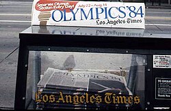 A Times newspaper vending machine featuring news of the 1984 Summer Olympics