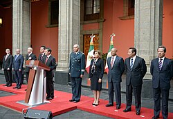 President Enrique Peña Nieto, accompanied by Cabinet members, holds a press conference in the Palacio Nacional announcing the capture of Joaquín Guzmán.