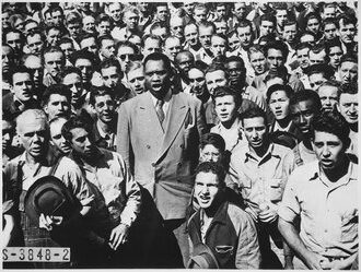 Robeson leading Moore Shipyard (Oakland, California) workers in singing the "Star Spangled Banner", September 1942