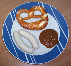 Weißwurst with sweet mustard and a pretzel