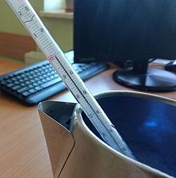 Boiling point of water measured at an altitude of ~370 m a.s.l. The 99.7 °C result reflects lower atmospheric pressure (~970 hPa), combined with minor instrument uncertainty and trace water impurities.