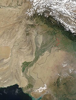 Satellite view of the Indus River Basin, showing snow in the mountain ranges—including the Himalayas—which feed the Indus river and its tributaries, and agricultural areas in eastern Pakistan and northwestern India that draw on them for irrigation.
