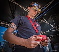 Drone racer wearing FPV goggles