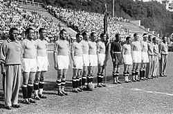 The Italy national football team lined up in midfield before the 1934 FIFA World Cup final, then won. The team fielded two Italian Argentines, Luis Monti and Raimundo Orsi.