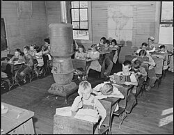 Students attending a crowded one-room schoolhouse with a single teacher in Fourmile, Kentucky, September 1946