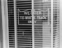 "We Cater to White Trade Only" sign on a restaurant window in Lancaster, Ohio, in 1938. In 1964, Martin Luther King Jr. was arrested and spent a night in jail for attempting to eat at a white-only restaurant in St. Augustine, Florida.