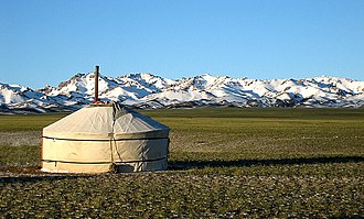 A yurt in front of the Gurvan Saikhan Mountains. Approximately 30% of Mongolia's 3 million people are nomadic or semi-nomadic.