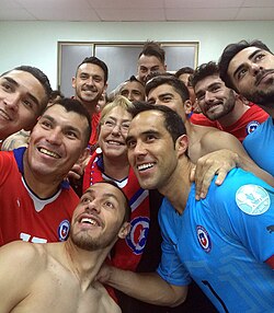 Bravo (front, in blue), with the rest of the Chilean squad and the nation's president Michelle Bachelet, ahead of the opening of the 2015 Copa América
