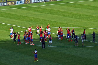 Costa Rica national football team players celebrating their classification at the FIFA World Cup 2014 for the round of 16 in first place of Group D at Mineirão stadium in Belo Horizonte after their draw with England.