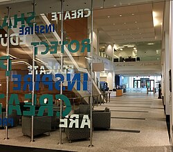 The lobby of the Public Search Facility, looking out toward the atrium, inside the Madison Building of the USPTO. The bronze bust of Thomas Jefferson is at the far right. Researchers can access patent search databases within the facility.