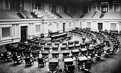 The U.S. Senate chamber, c. 1873; two or three spittoons are visible by desks.