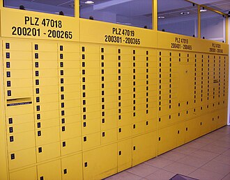 P. O. box racks in a German post office of the Duisburg post code area. The top number is the postal code (PLZ=Postleitzahl) for the individual rack.