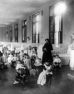 Sister Irene of New York Foundling Hospital with children. Sister Irene is among the pioneers of modern adoption, establishing a system to board out children rather than institutionalize them.