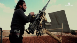 An FSA fighter loads a US-made M2 Browning heavy machine gun in northern Aleppo, November 2016.