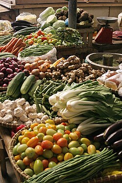 Vegetables separated with baskets in a market in the Philippines