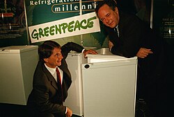 Peter Melchett, right, (then ED of Greenpeace UK) with Malcolm Walker, (Chairman Iceland Frozen Foods) and a Greenfreeze fridge, 1998