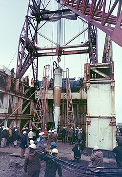 The nuclear device that sparked the creation of Greenpeace being lowered into its firing hole for Cannikin.