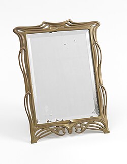 A beveled glass mirror, ca. 1910