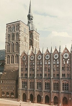 The Hanseatic League left a significant cultural and architectural heritage. It is especially renowned for its Brick Gothic monuments, such as Stralsund's St. Nikolai Church (built in the 13th-14th centuries, with some later additions) and its City Hall (built c. 1230-1444), shown here. The old town of Stralsund, together with Wismar, is a UNESCO World Heritage Site.