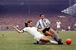 Wolfgang Weber (left) and Luis Artime during the match between West Germany and Argentina in Birmingham