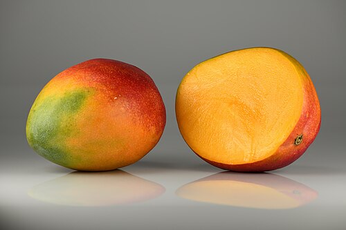Mango fruit – whole and halved