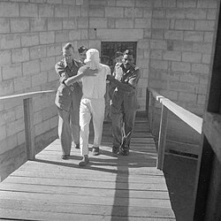 In Singapore, a hooded Lieutenant Nakamura is led to the scaffold after being convicted of beheading an Indian soldier on the Palau Islands, March 1946.