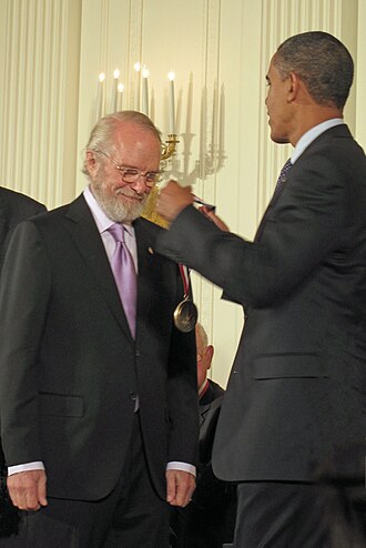 Dr. Warnock receives National Medal of Technology and Innovation from President Barack Obama in 2009.