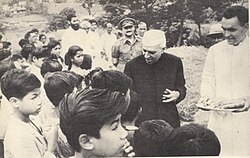 Nehru distributes sweets among children at Nongpoh, Meghalaya