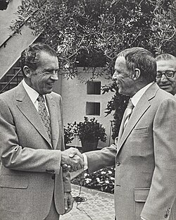 Sinatra shaking hands with President Richard Nixon in 1972